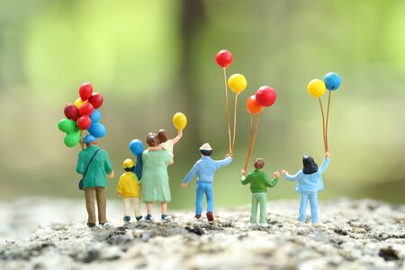 Miniature people: traveler standing in park outdoor, Business concept using as backgroundの写真素材