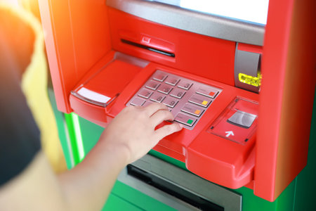 human hand pressing keypad ATM/ bank machineの写真素材