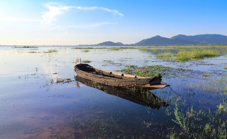 fishing boat with sunset in riverの写真素材