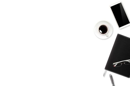 workspace table with laptop computer, office supplies, coffee cup, cell phone and coffee cup on white backgroundの写真素材