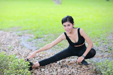 young healthy and sporty woman do yoga stretching outdoorの写真素材