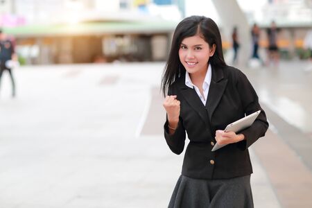 successful and happy businesswoman holding tabletの写真素材