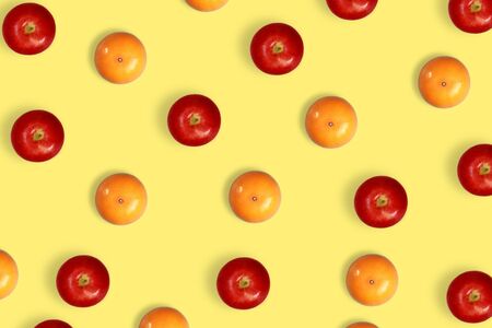 orange and apple pattern on yellow pastel backgroundの写真素材