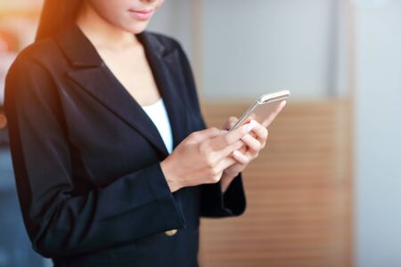 businesswoman hands using smart phoneの写真素材