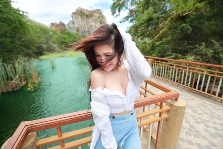 portrait of beautiful woman in nature outdoors with smilingの写真素材