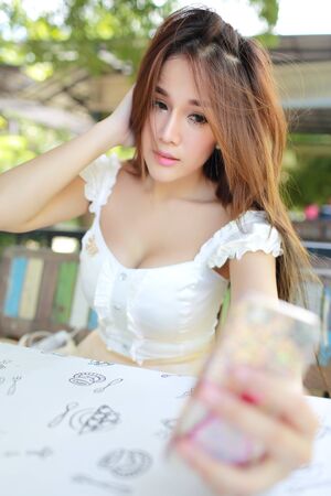 image of beautiful and cute woman portrait herselfの写真素材