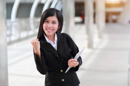 successful and happy businesswoman holding tabletの写真素材