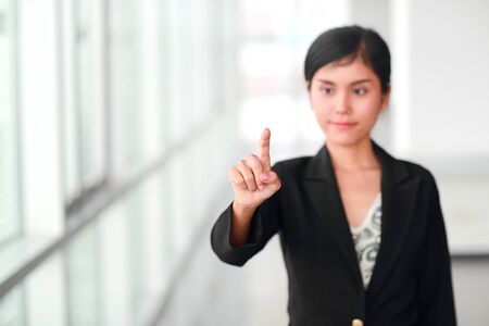 businesswoman pointing fingerの写真素材