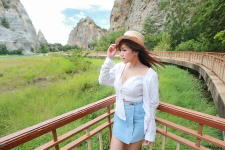 portrait of beautiful woman in nature outdoors with smilingの写真素材