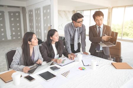 businesspeople meeting and discussing with graph and chart and showing successful result using as background (concept of successful and achievement)の写真素材