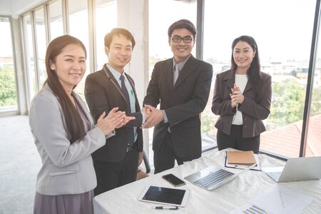 businesspeople meeting and discussing with graph and chart and showing successful result using as background (concept of successful and achievement)の写真素材