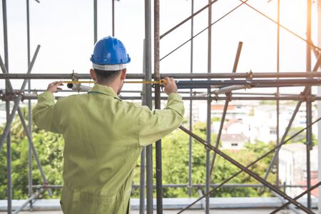 engineering man working from back view  at construction siteの写真素材