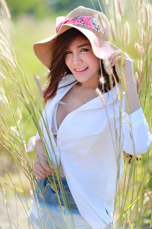 portrait of beautiful woman in nature outdoors with smilingの写真素材