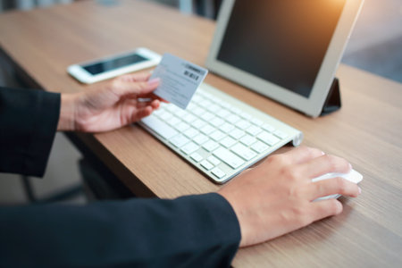 businesswoman hands using table, cell phone and credit card