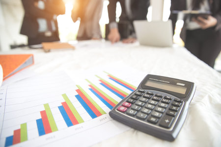 businesspeople meeting and discussing with graph and chart and showing successful result using as background (concept of successful and achievement)の写真素材