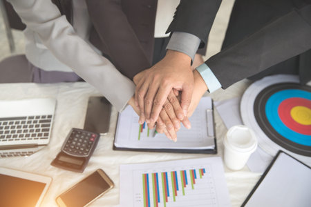 portrait business people hand together using as background (concept of teamwork and partnership)の写真素材