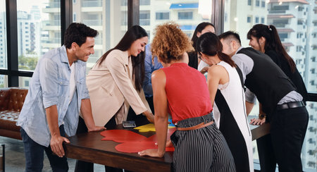 meeting of multiethnic business people brainstroming in modern business with city view background