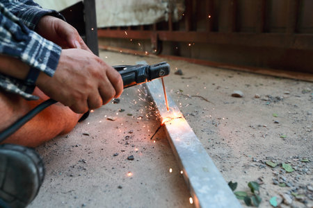 worker welding at construction site