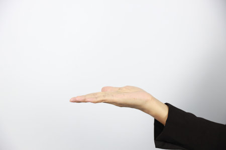 businesswoman hand in black business suit uniform showing something on white background