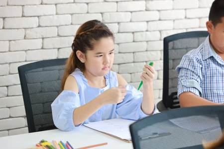 two school kids drawing in class (education concept)