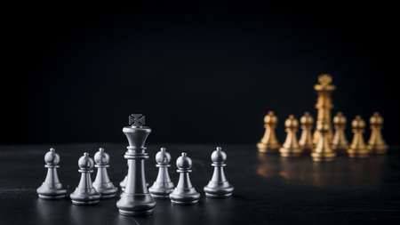 Business chess board game of business strategy and tactic on retro wooden table, idea for management competition, success and leadership concept with copy space for your advertising content.の写真素材