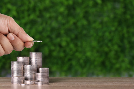 Business investment and saving growth for advertising concept. Businessman hand stacking coin...