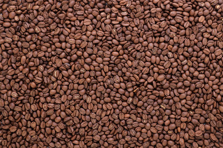 Freshly roasted coffee beans background top view using for your advertisingの写真素材