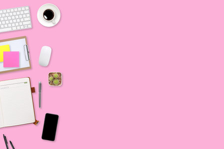 flat lay workspace table desk with laptop computer, office supplies, coffee cup, tablet and mobile smartphone on color backgroundの写真素材