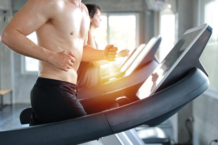 close up image of healthy and sexy caucasian muscle man in shirtless who running on excercise...