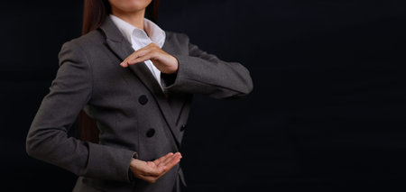 Attractive professional female hands in classic suit show protecting something. Businesswoman...