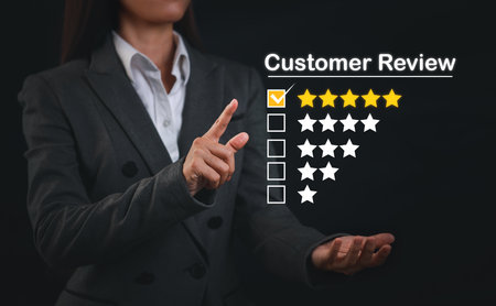 Attractive professional businesswoman hands rating five star icon with excellent rating for service evaluation on virtual touch screen interactive. Customer satisfied survey experience conceptの写真素材