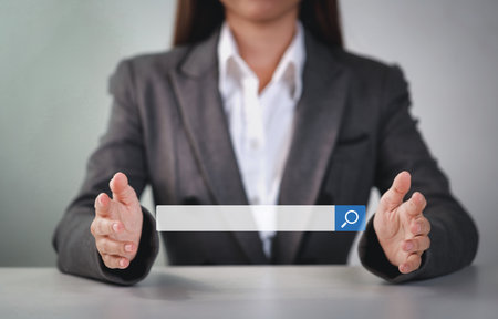 Attractive female hands using laptop computer keyboard searching, browsing internet data online information with search bar console interactive on screen. Lifestyle with technologyの写真素材