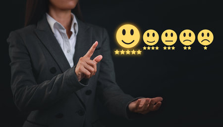 Attractive professional businesswoman hands rating five star icon with excellent rating for service evaluation on virtual touch screen interactive. Customer satisfied survey experience conceptの写真素材