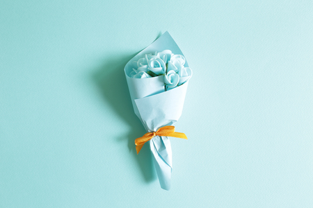 Blue flower bouquet on blue backgroundの写真素材