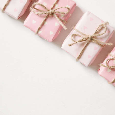 Pink gift on white painted backgroundの写真素材