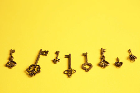 Different keys on yellow background. Choice and right solution concept