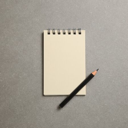 Empty notepad on gray backgroundの写真素材
