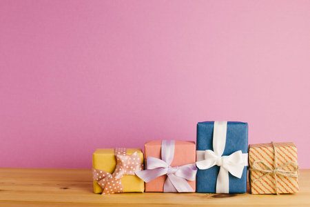 Gift boxes on wooden table. Christmas or birthday concept