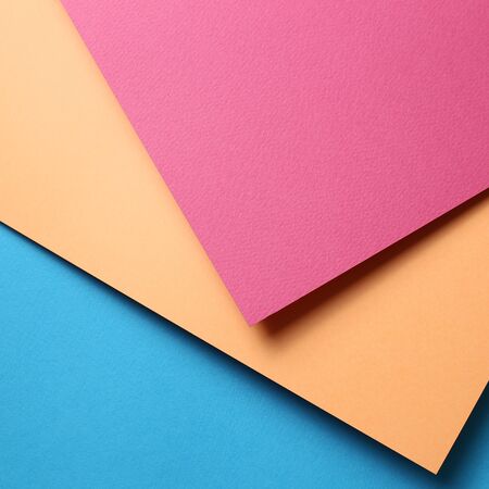 Pink and orange and blue paper backgroundの写真素材