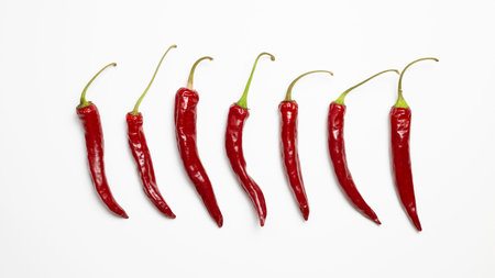 Red hot chilli peppers on white background. flat lay, top view