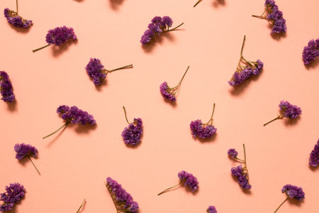 Pink purple statice flowers pattern background. Floral composition, flat lay, top view