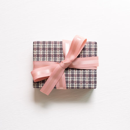 Pink gift box isolated on white background. top view