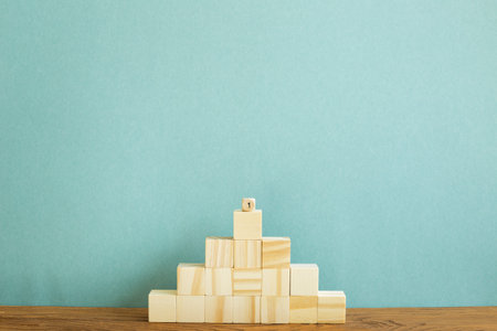 Wood block stairs with green background. Business development, growth, success concept
