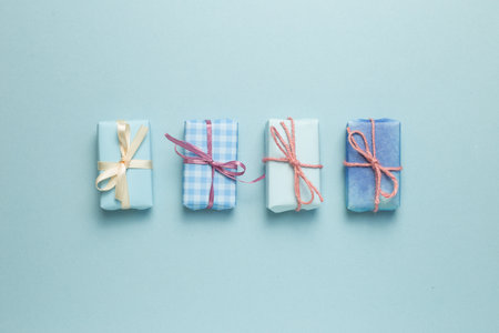 Blue gift boxes on sky blue background. flat lay, top view, copy spaceの写真素材