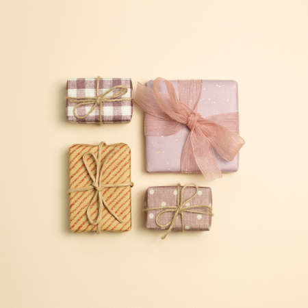 Gift boxes on beige background. flat lay, top view, copy spaceの写真素材