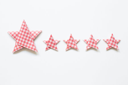 Red check pattern Five stars quality rating on white background. top view