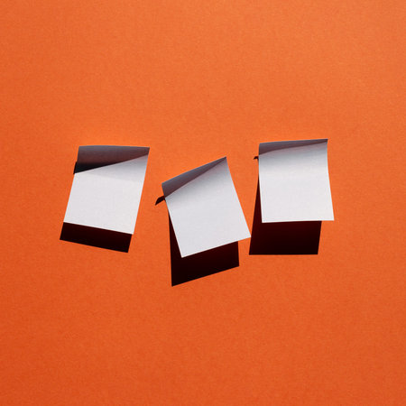 Blue sticky note paper on red background. copy space