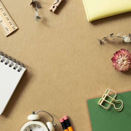 Various office supplies on brown background. workspace. flat lay, top view, copy space