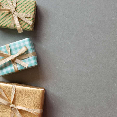 Colorful gift boxes on gray background. flat lay, top view, copy spaceの写真素材