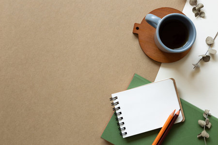 Diary note and cup of coffee on brown and white background. flat lay, top view, copy space
